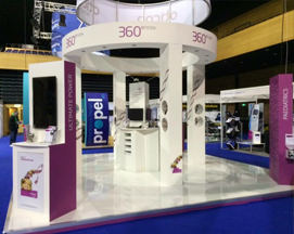 An open plan mid room exhibition stand design for Oticon provided 360 degree footfall throughout the event.
