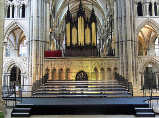 Stage with steps situated within a cathedral.